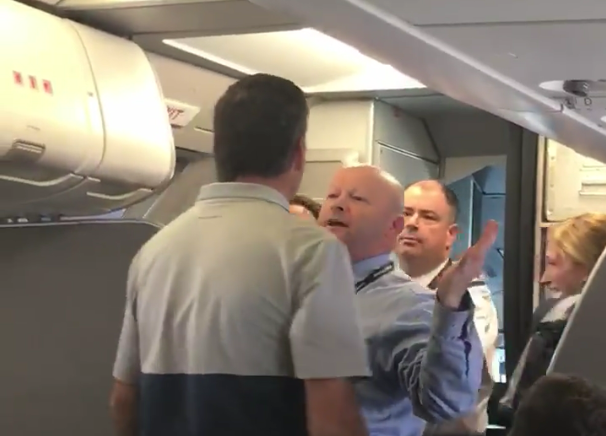 Flight attendant hits woman midflight, people on plane freak out
